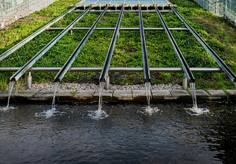 wellness water company - a water spigot in the middle of a pond