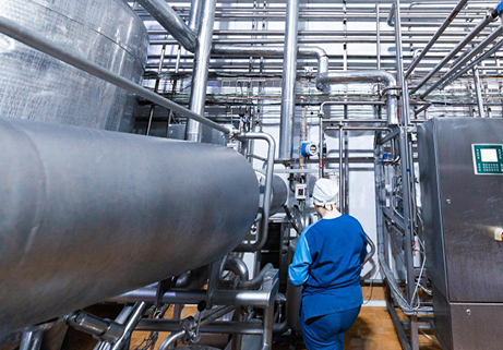 wellness water company - a man in a blue suit is working in a factory