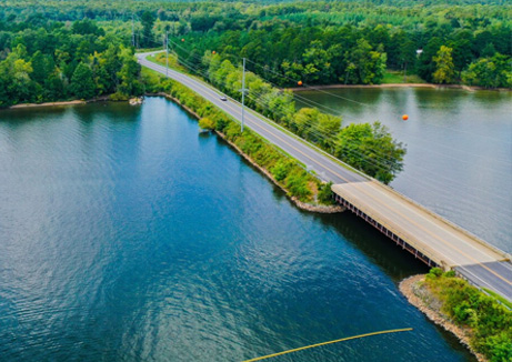 wellness water company - an aerial view of a bridge over a large body of water