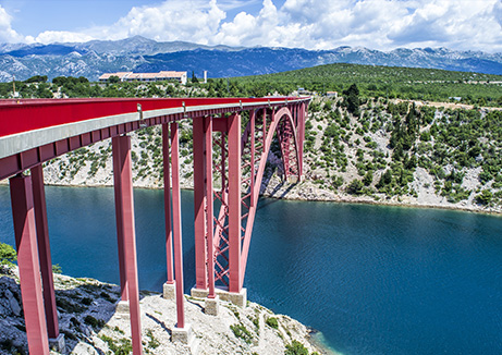 wellness water company- a red bridge over water